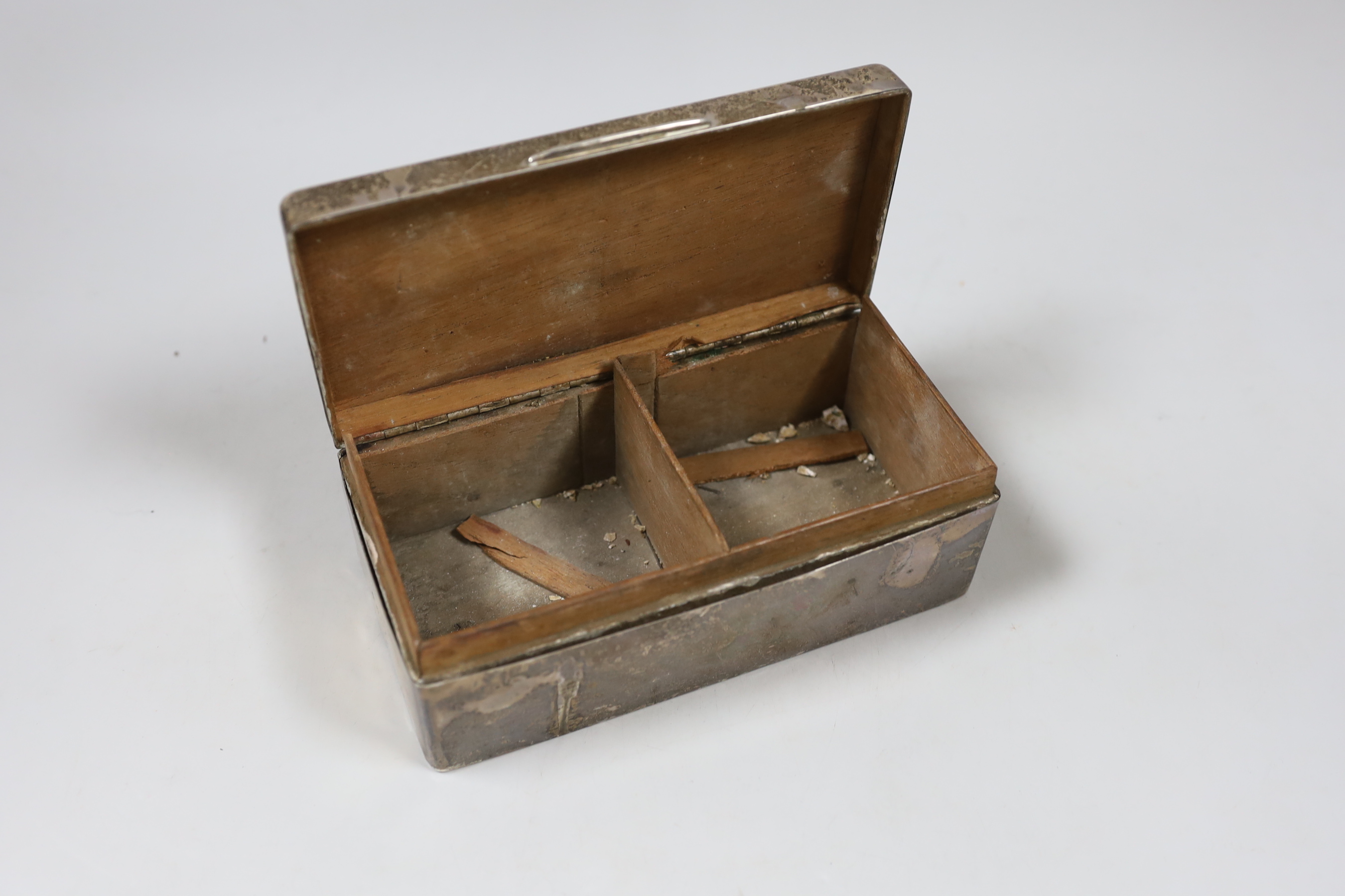 A George V silver mounted cigarette box, with engraved inscription, Birmingham, 1925, 17.5cm.